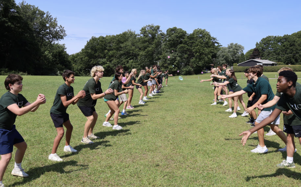 Sophomores playing water balloon toss during the summer reading celebration. 